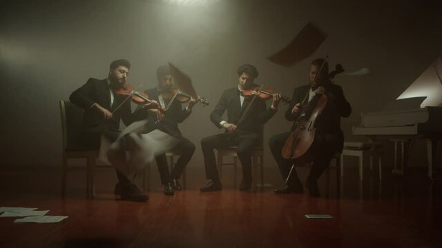 the string quartet plays classical music,notes fall from the air