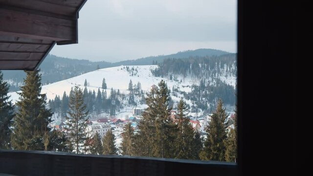 View out of window spectacular mountain winter lanscape and fir forest. Winter vacation. Inspiration, nature concept.