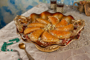 Stuffed Qatayef with nuts . A typical dessert of the the Arab world in the Holy month of Ramadan 