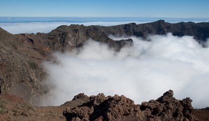 Sea of clouds covering a volcanic crater.