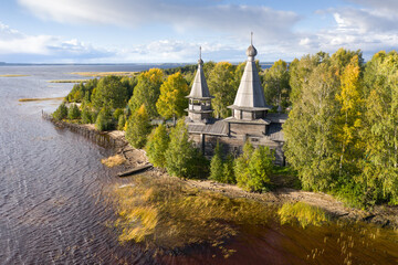 Aerial view of old wooden Epiphany Church at shore of Lake Onega in Chyolmuzhi village. Traditional...