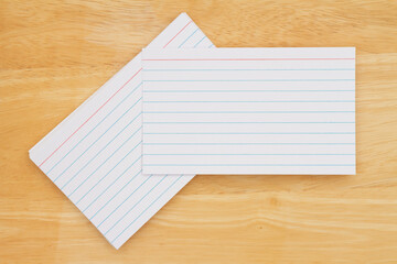 Retro white paper index cards on wood desk
