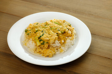Thai food, Curry powder mixed chicken with mixed vegetable, spring onions. Served in white plate