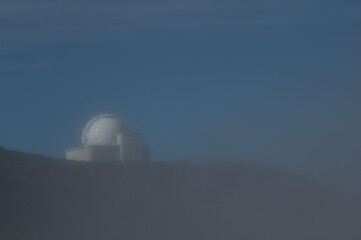 Astronomical telescope in the fog.
