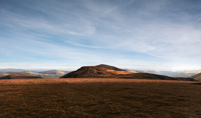 Nature, summer landscape in carpathian mountains,  grass on hills, beautiful cloudy sky