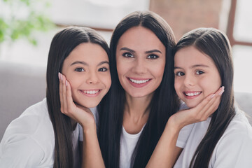 Close-up portrait of beautiful tender careful cheerful girls friends enjoying cuddling at house...