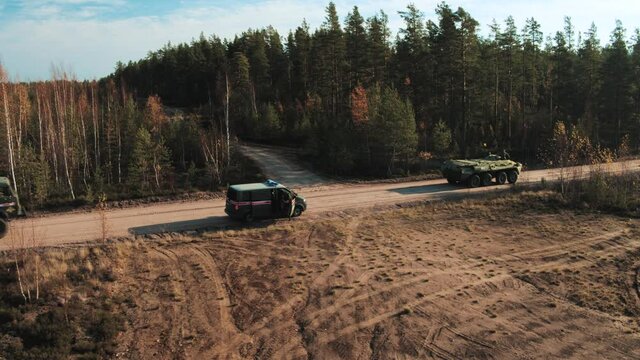 A military column of armored vehicles.
