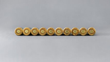 Bullets bottom on gray background. Cartridges 7.62 caliber for Kalashnikov assault rifle closeup...
