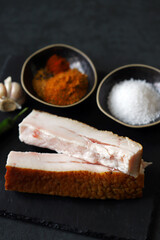 Fresh lard and spices. Salting lard.