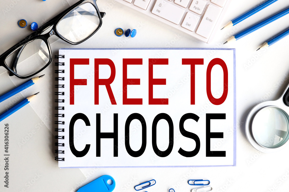 Poster free to choose. text on white notepad paper on a light background near the keyboard and glasses.