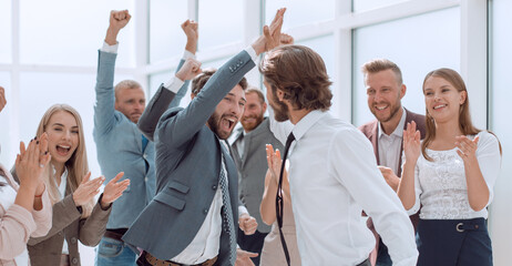 Obraz na płótnie Canvas business team congratulating each other on the victory