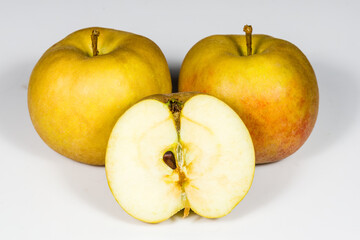 Ripe Boskoop apples on a white background in section