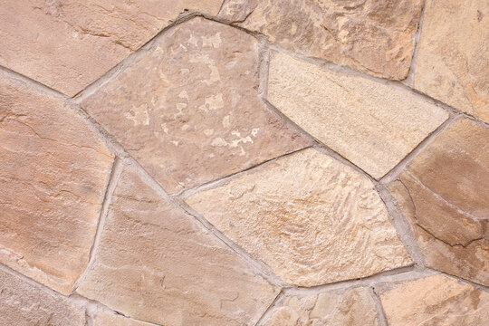 Texture of a stone wall. Beige background. Natural stone texture.