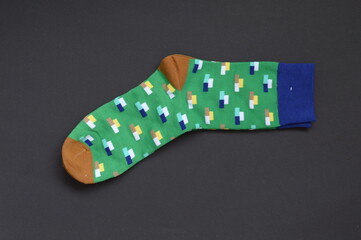 multicolored socks on black background