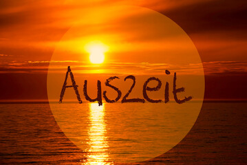 German Text Auszeit Means Downtime. Romantic Sunset Or Sunrise At Sea Or Ocean In The Background