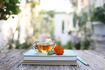 tea cup and flower and notebook