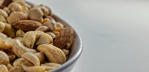 Close up of nuts in a bowl. Macro with selective focus and bokeh.