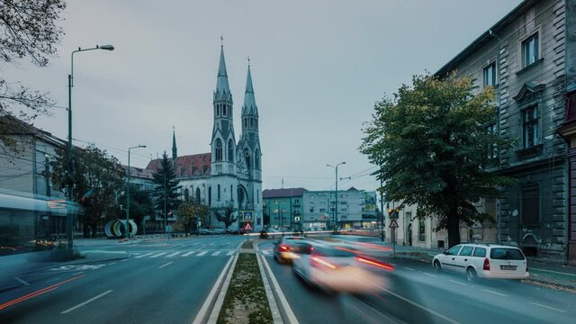 Time lapse street view of the Elisabetin Romano-Catholic Church in Timisoara city &ndash; Romania; CCA. 2019 - before the COVID-19 pandemic.