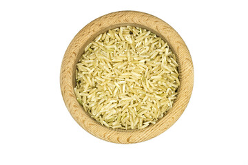 brown rice in wooden bowl on white background top view