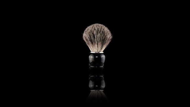 The men's shaving brush turns on its axis