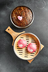 Closed bao bun with sweet berry inside. Delicious chinese steamed sweet food. Chinese, asian, authentic food concept