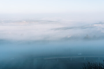 Stock photo of almost empty highway during foggy day.