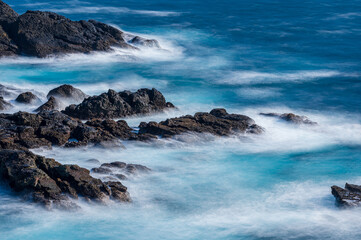 waves breaking on rocks