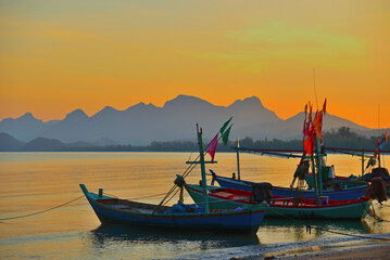 Fototapeta premium Fishing boat on the beach in evening. Thailand.