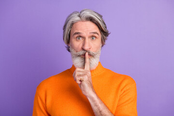 Photo of aged man close cover finger lips shh keep secret conspiracy isolated over purple color background