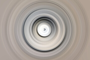 Abstract radial motion blur in grays, beige and white shades. Round pattern for design of labels, textiles, clothing or brochures. Background for modern graphic design and text. 
