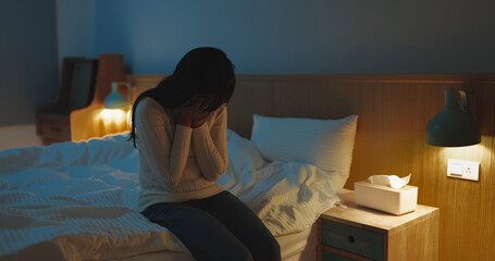 woman feel depress in bedroom