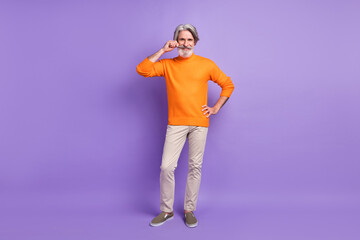 Full length photo of mature man happy positive smile hand touch mustache isolated over violet color background