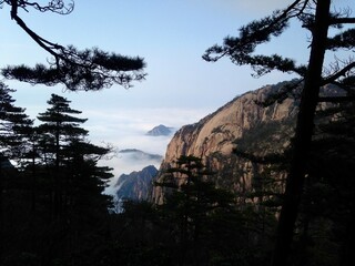 China Mount HuangShan - April, 2015: Natural scenery, sunsets, peculiarly-shaped granite peaks, Huangshan pine trees and views of the clouds from above. Photo taken in Yellow Mountain (UNESCO).