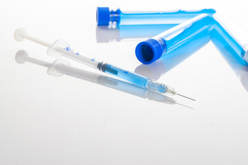 Medical equipment. Medical syringe with needle for protection flu virus and coronavirus. Covid vaccine on white. Disease care hospital prevention.