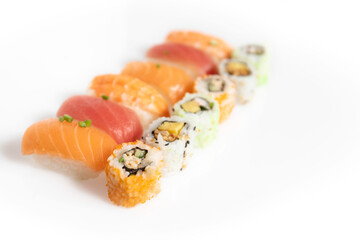 Set of sushi and maki isolated at white background, top view. Salmon, tuna and sushi rolls. Asian healthy restaurant food delivery