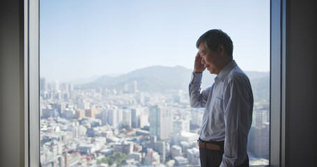 Fototapeta premium Stressed senior businessman