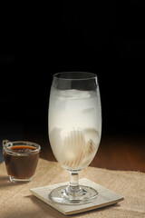 Fresh blending coffee Arabica with sweet coconut juice for health care drinking in home. drinks in summer on dark background copy space.