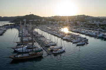 Fototapeta premium View of beautiful harbor and boats at sunset. Picturesque view of the port of Bodrum with the sailing boats at Turkey.