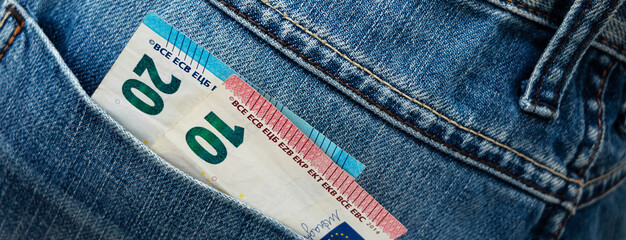 Euro bill in the back pocket of jeans. ThirtyEuro in a denim pocket.