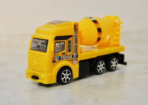 yellow truck concrete mixer on a light background