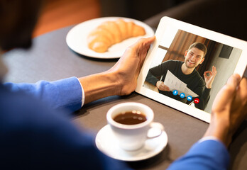 Two Men Having Online Video Call On Tablet