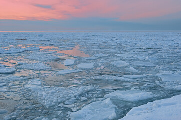 Winter landscape at twilight of icebergs, Lake Michigan, Saugatuck Dunes State Park, Michigan, USA