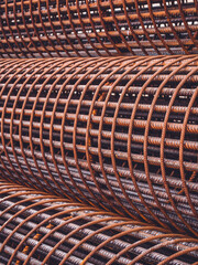 Iron on construction site. Iron reinforcement concrete . rebar for reinforce hole in the ground. Texture background net metal red