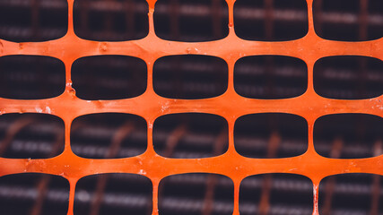 orange plastic net on construction site. Texture background of net. orange rectangle pattern