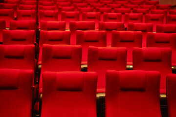 Red chairs in an empty concert hall
