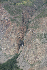 Waterfall in the Valley of the river of Chulyshman. Altai mountains, Russia, beautiful summer day