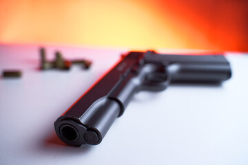 Big black gun pistol on white table.