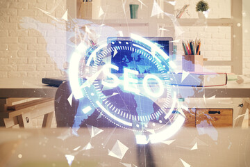 Double exposure of SEO drawing and office interior background. Concept of Search optimization...