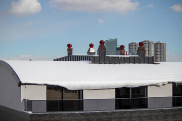 
snowy city texture, chimneys on the roofs.