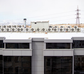 Obraz premium building in the city, There are many air conditioners on it.